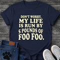 Bold retro puffy graphic tee design reading "Don't Worry, My Life Is Run by 5 Pounds of Foo Foo," in cream outlined type.