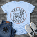 French Bulldog t-shirt with vintage stamp style circular badge, detailed engraving illustration of a Frenchie standing full body, arched text reading Bat Ear Brigade in distressed terracotta and navy, worn vintage texture throughout, no background