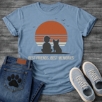 French Bulldog t-shirt with retro striped sunset scene, human and Frenchie silhouette sitting together facing the sun, birds in flight above, light text below reading Best Friends Best Memories, two-color vintage illustration graphic