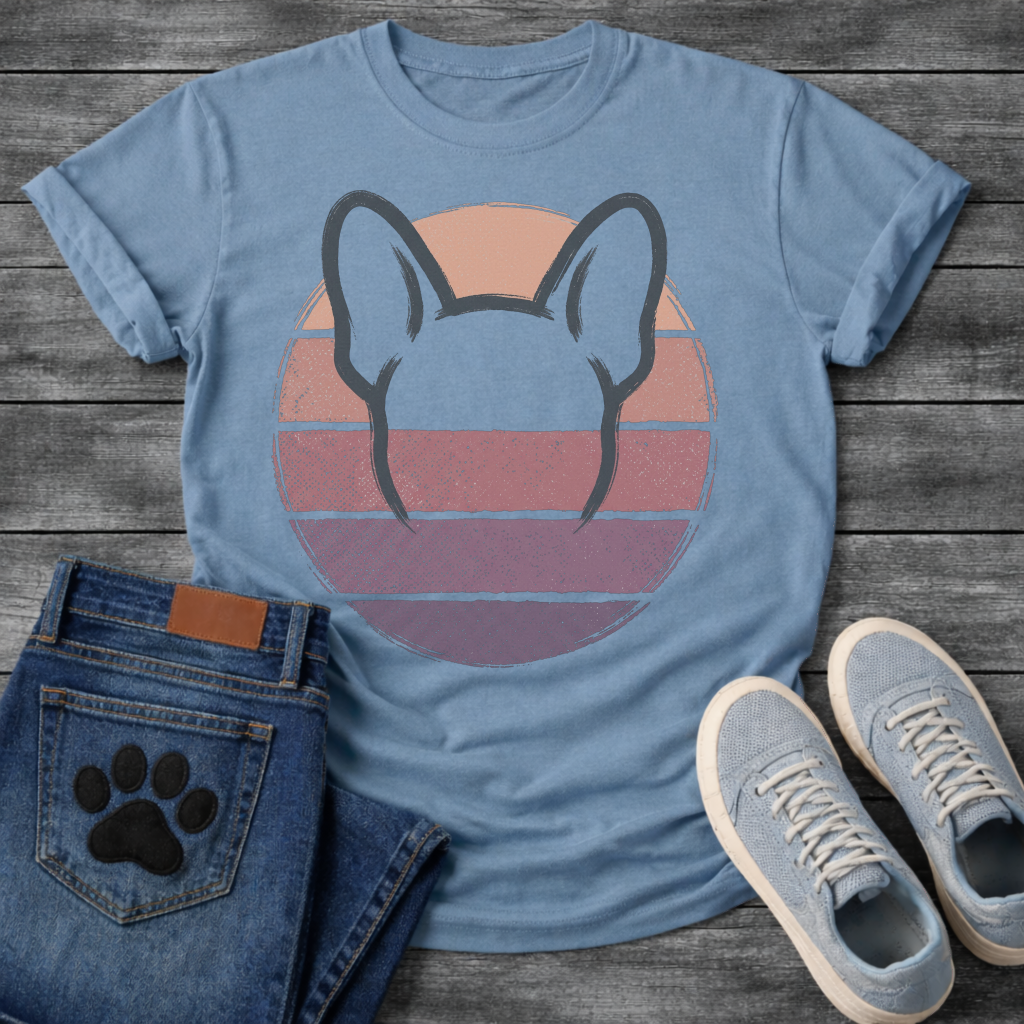 French Bulldog t-shirt with minimal brush ink Frenchie head seen from behind, bold bat ears outlined against a retro striped circle sunset in blush pink mauve and deep purple tones, distressed vintage texture, no text fine art graphic
