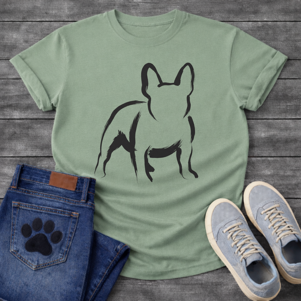 French Bulldog t-shirt with loose gestural brush ink Frenchie illustration seen from behind, bold confident brushstrokes suggesting the form with minimal fill, single black ink on warm tee, fine art gallery style graphic