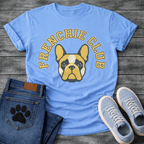 French Bulldog t-shirt with bold collegiate arched text reading Frenchie Club in gold with navy outline, geometric fawn and black Frenchie face portrait centered below, clean varsity style graphic
