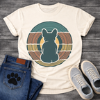 French Bulldog t-shirt with Frenchie silhouette seen from behind centered in layered concentric rings of teal terracotta and gold that bend and wrap around the figure, golden circle glowing behind, no text, bold retro graphic art