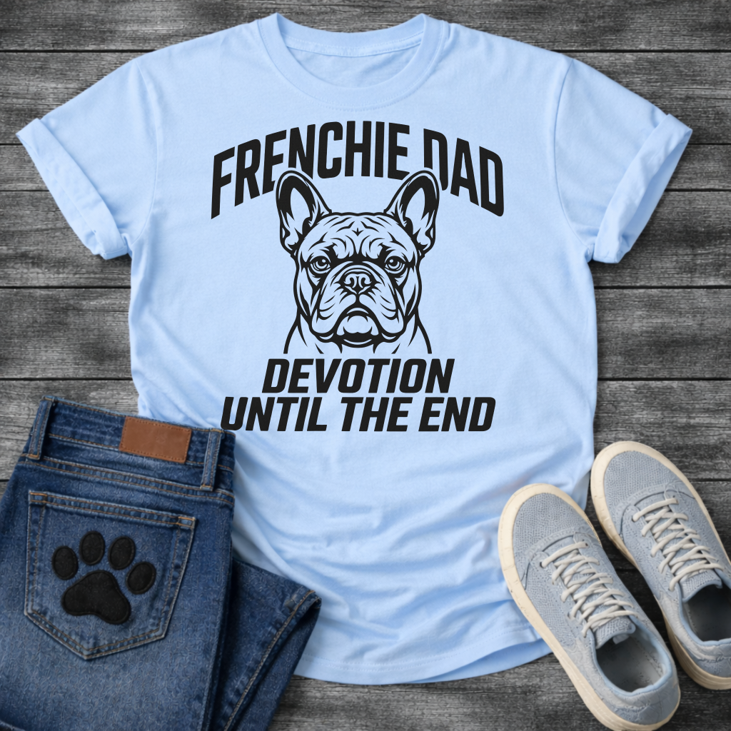 French Bulldog t-shirt with bold collegiate arched text reading Frenchie Dad above a detailed Frenchie portrait, bold italic condensed text reading Devotion Until The End below, single black ink on warm sand tee

