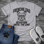 French Bulldog t-shirt with bold collegiate arched text reading Frenchie Dad above a detailed Frenchie portrait, bold italic condensed text reading Devotion Until The End below, single black ink on warm sand tee

