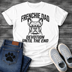 French Bulldog t-shirt with bold collegiate arched text reading Frenchie Dad above a detailed Frenchie portrait, bold italic condensed text reading Devotion Until The End below, single black ink on warm sand tee
