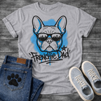 French Bulldog t-shirt with graffiti style Frenchie wearing city skyline sunglasses, electric blue spray paint halo behind the portrait, bold graffiti tag text reading Frenchie Dad with star and blue drip below