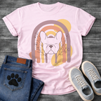 French Bulldog t-shirt with peaceful Frenchie face eyes closed centered in a boho rainbow arch, wildflower and botanical line art on either side, muted purple terracotta gold and cream tones, abstract circles in background, soft boho illustration no text