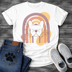 French Bulldog t-shirt with peaceful Frenchie face eyes closed centered in a boho rainbow arch, wildflower and botanical line art on either side, muted purple terracotta gold and cream tones, abstract circles in background, soft boho illustration no text