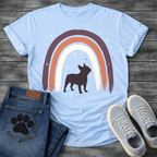 French Bulldog t-shirt with bold Frenchie silhouette standing beneath a brushstroke boho rainbow arch in deep plum terracotta and cream, scattered stars inside and outside the arch, no text, warm boho illustration graphic