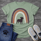 French Bulldog t-shirt with bold Frenchie silhouette standing beneath a brushstroke boho rainbow arch in deep plum terracotta and cream, scattered stars inside and outside the arch, no text, warm boho illustration graphic