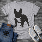 French Bulldog t-shirt with bold filled brush ink Frenchie standing facing forward, heavy gestural brushstrokes with white chest detail visible, single black ink on warm tee, expressive fine art graphic no text