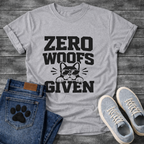 Funny dog shirts featuring Zero Woofs Given text with paw prints