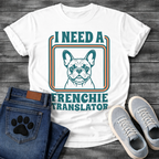 French Bulldog t-shirt with retro 70s groovy typography reading I Need a Frenchie Translator, detailed Frenchie portrait centered in teal and orange rounded rectangle frame, two-color retro illustration on warm sand tee