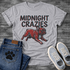 French Bulldog t-shirt with bold retro shadow typography reading Midnight Crazies above a halftone Frenchie running at full speed in deep red and slate blue, vintage circus style graphic

