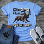 French Bulldog t-shirt with black and white ransom cut-out block typography reading Midnight Zoomies above a photorealistic halftone Frenchie running at full speed, bold ransom text below reading Uncontrolled Burst, high contrast punk graphic