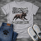 French Bulldog t-shirt with black and white ransom cut-out block typography reading Midnight Zoomies above a photorealistic halftone Frenchie running at full speed, bold ransom text below reading Uncontrolled Burst, high contrast punk graphic