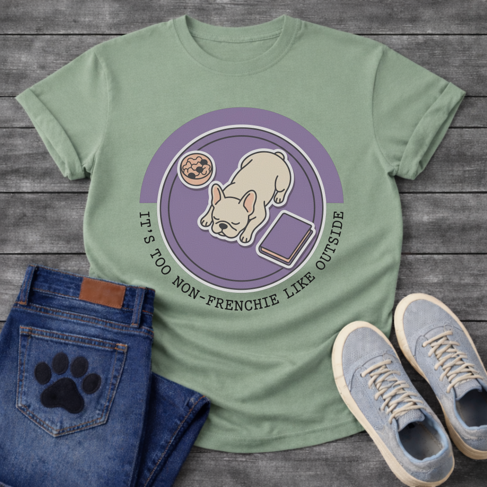 French Bulldog sleeping top-down view with food bowl and book It's Too Non-Frenchie Like Outside badge graphic tee
