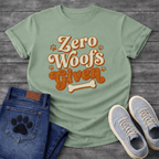 Zero woofs given playful orange lettering dog shirt with paw prints and bone