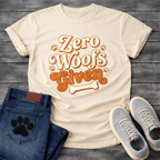 Zero woofs given playful orange lettering dog shirt with paw prints and bone