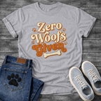 Zero woofs given playful orange lettering dog shirt with paw prints and bone