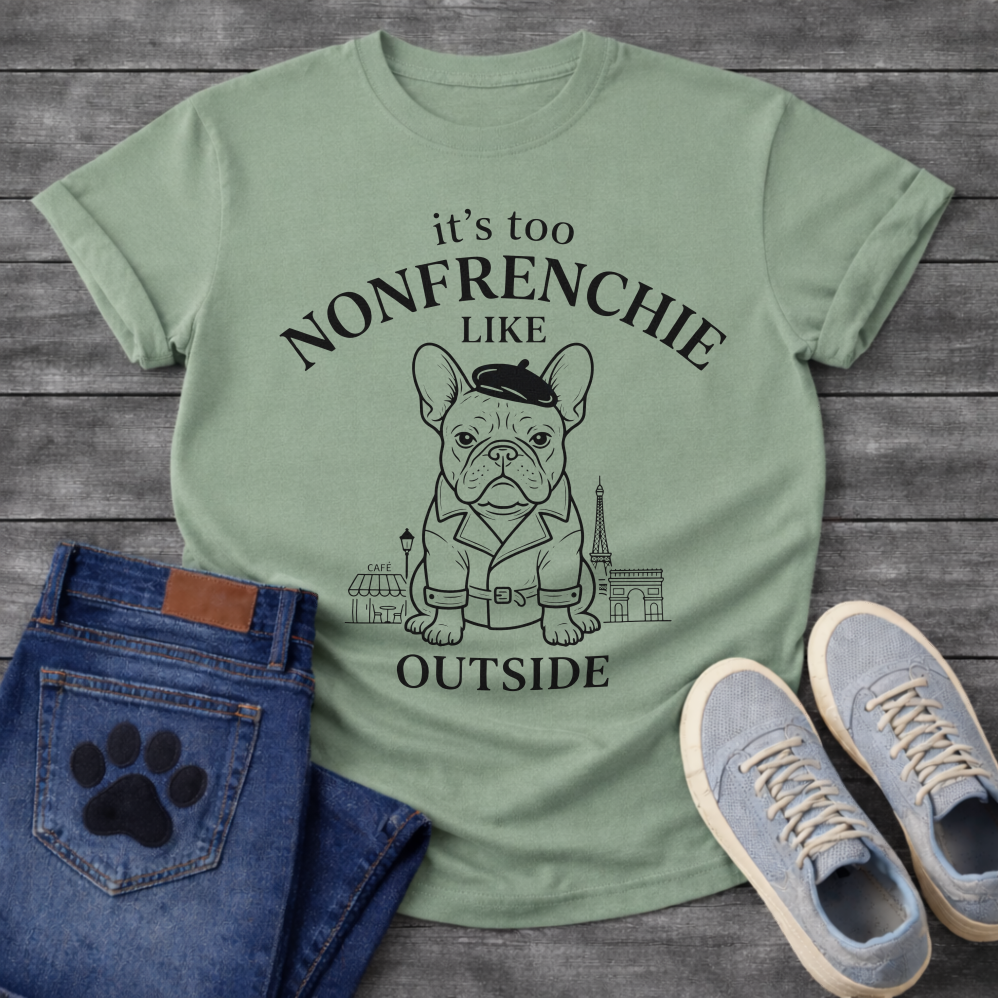 French Bulldog in beret and trench coat with Paris skyline It's Too Non-Frenchie Like Outside typography graphic tee
