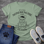 French Bulldog in beret and trench coat with Paris skyline It's Too Non-Frenchie Like Outside typography graphic tee
