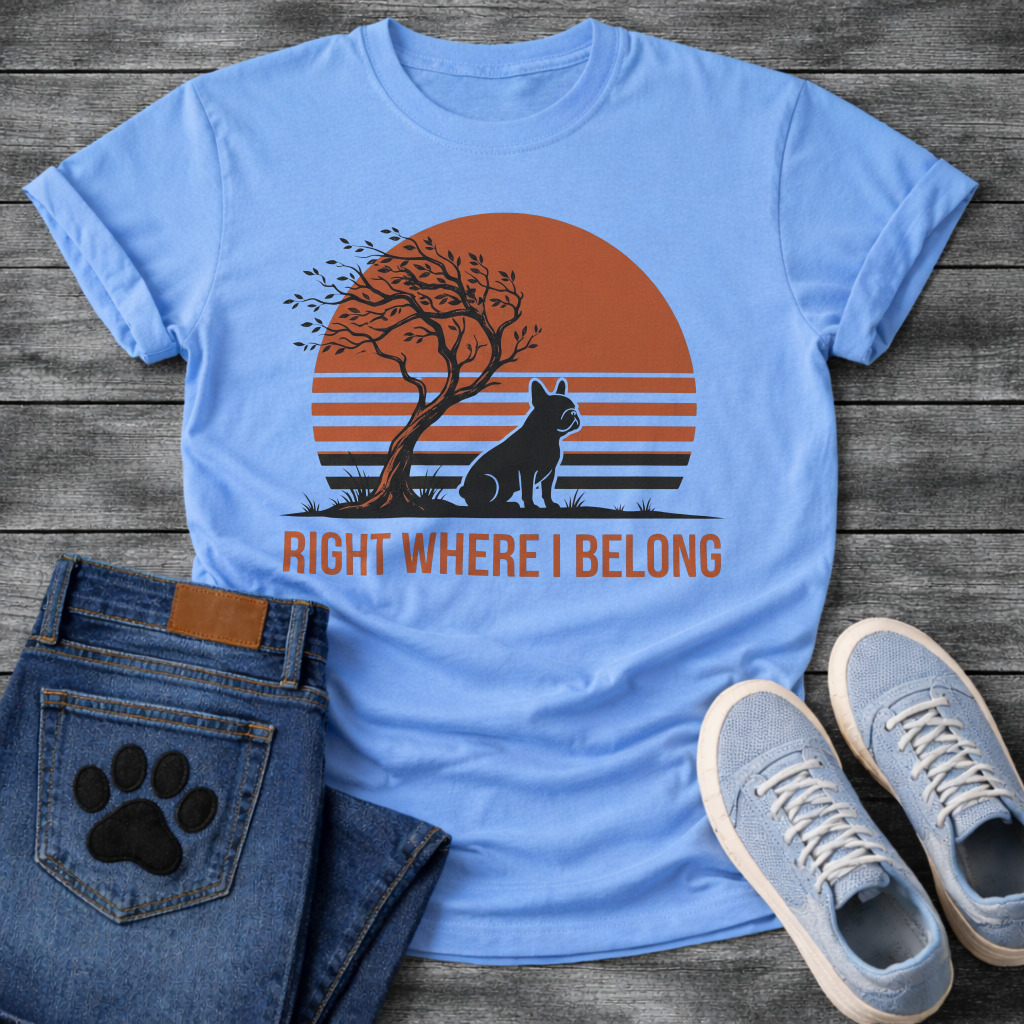 French Bulldog t-shirt with retro striped sunset scene, Frenchie silhouette sitting beside a windswept tree against a large terracotta sun, bold text below reading Right Where I Belong, two-color vintage landscape illustration
