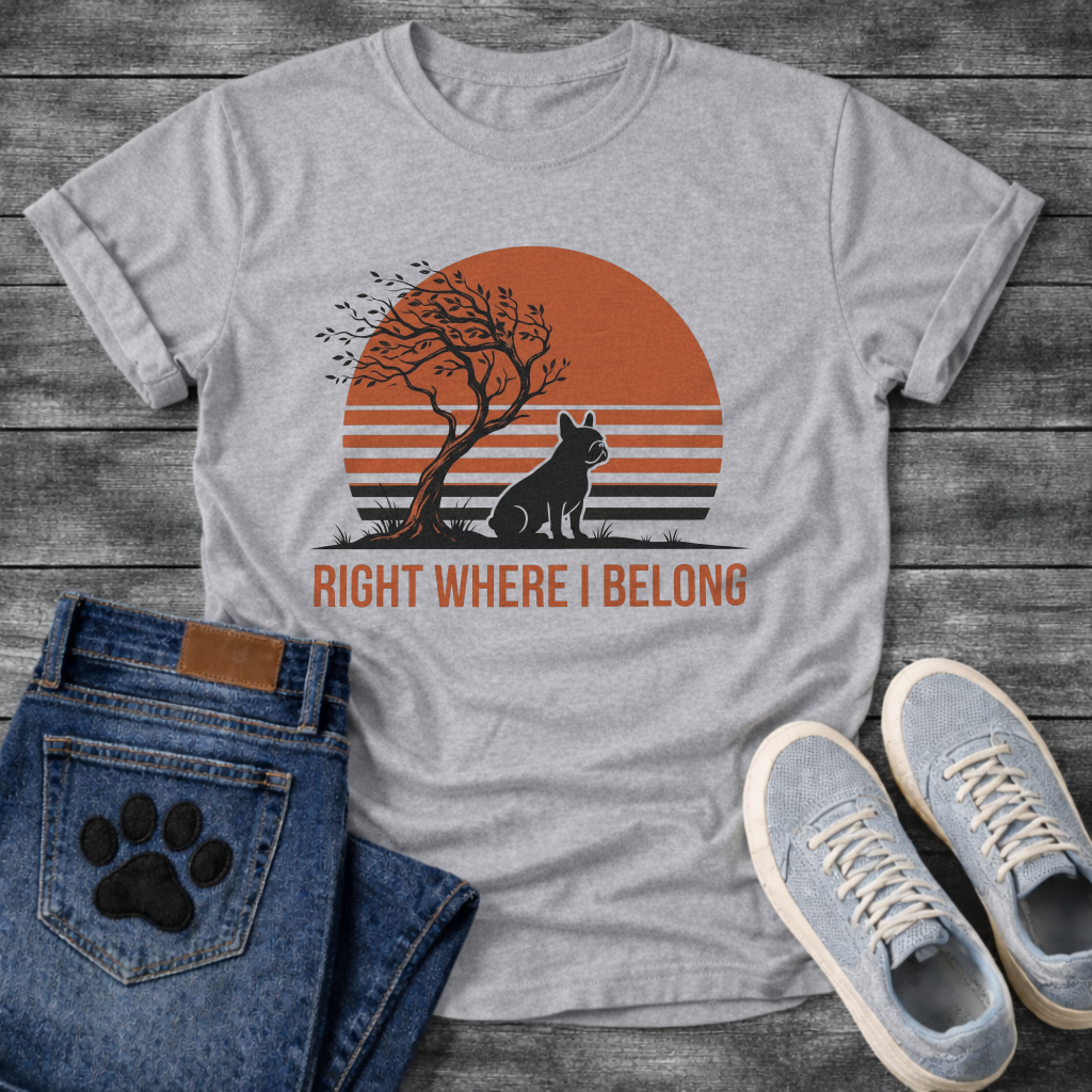 French Bulldog t-shirt with retro striped sunset scene, Frenchie silhouette sitting beside a windswept tree against a large terracotta sun, bold text below reading Right Where I Belong, two-color vintage landscape illustration
