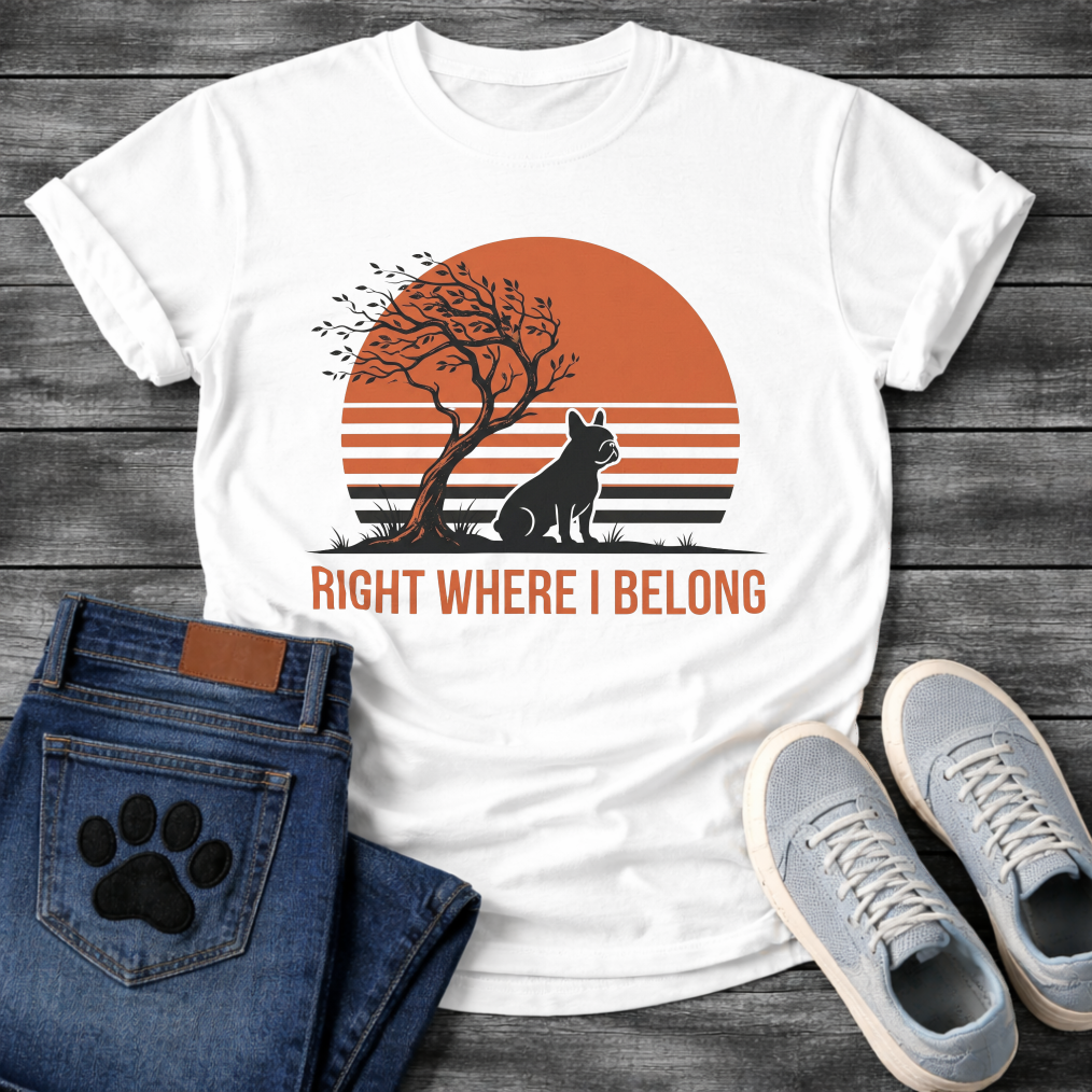French Bulldog t-shirt with retro striped sunset scene, Frenchie silhouette sitting beside a windswept tree against a large terracotta sun, bold text below reading Right Where I Belong, two-color vintage landscape illustration
