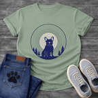 French Bulldog silhouette seated in front of a full moon with concentric rings and pine trees, navy and cream circular badge graphic tee