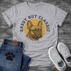 French Bulldog t-shirt with detailed engraving style Frenchie portrait centered in a gold circle, distressed collegiate arched text reading Sassy But Classic, black and gold two-color vintage graphic
