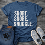 Snort Snore Snuggle bold white typography graphic tee on black