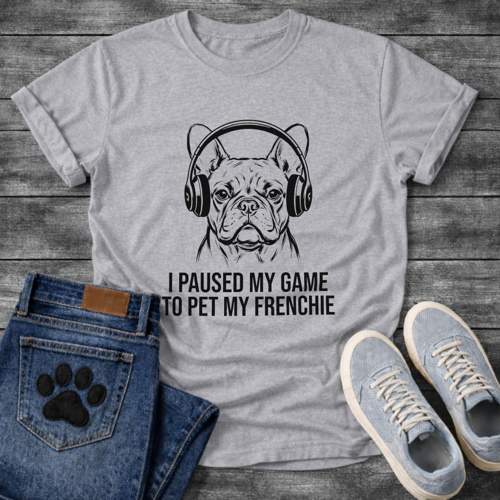 French Bulldog wearing gaming headphones graphic tee, gestural ink illustration, text reads I Paused My Game To Pet My Frenchie