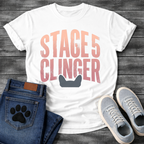 French Bulldog t-shirt with oversized distressed brush typography reading Stage 5 Clinger in dusty rose and mauve tones, small Frenchie head silhouette peeking up from the bottom of the design, no text graphic