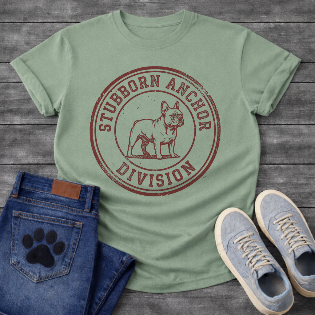 French Bulldog t-shirt with vintage rubber stamp circular badge, detailed Frenchie standing portrait centered, distressed collegiate text reading Stubborn Anchor Division around the border, single terracotta ink with heavy worn texture