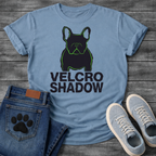 French Bulldog t-shirt with dark filled Frenchie portrait traced in neon green outline, bold oversized black text reading Velcro Shadow below, two-color black and neon green streetwear graphic