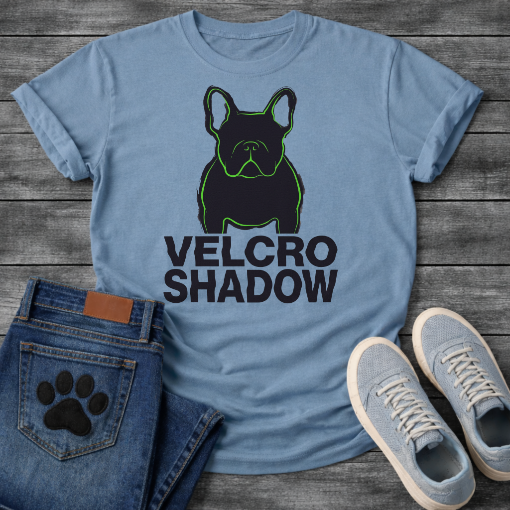 French Bulldog t-shirt with dark filled Frenchie portrait traced in neon green outline, bold oversized black text reading Velcro Shadow below, two-color black and neon green streetwear graphic