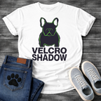 French Bulldog t-shirt with dark filled Frenchie portrait traced in neon green outline, bold oversized black text reading Velcro Shadow below, two-color black and neon green streetwear graphic