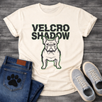 French Bulldog t-shirt with oversized bold black text reading Velcro Shadow above a detailed Frenchie portrait with neon green outline, black and green two-color streetwear graphic