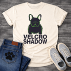 French Bulldog t-shirt with dark filled Frenchie portrait traced in neon green outline, bold oversized black text reading Velcro Shadow below, two-color black and neon green streetwear graphic