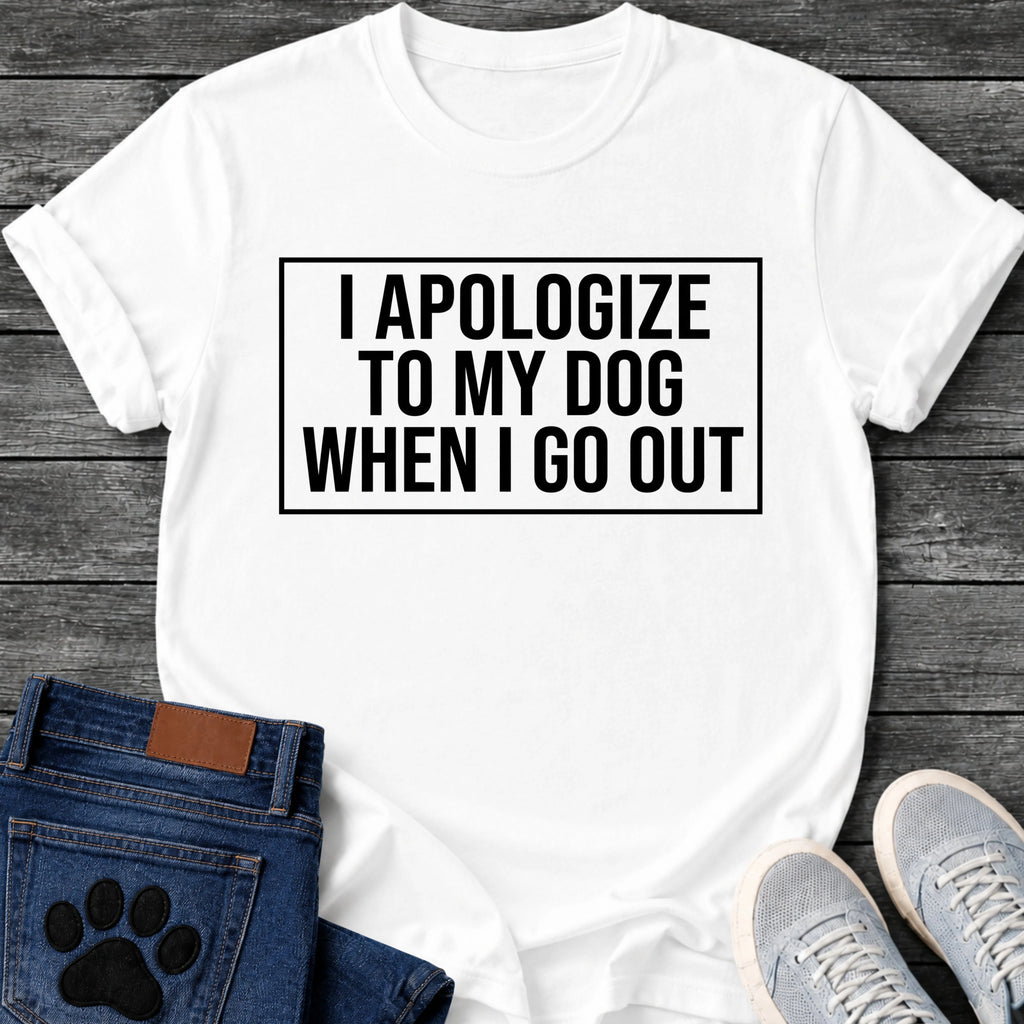 Bold boxed graphic tee design reading "I Apologize to My Dog When I Go Out," in a clean rectangular frame.