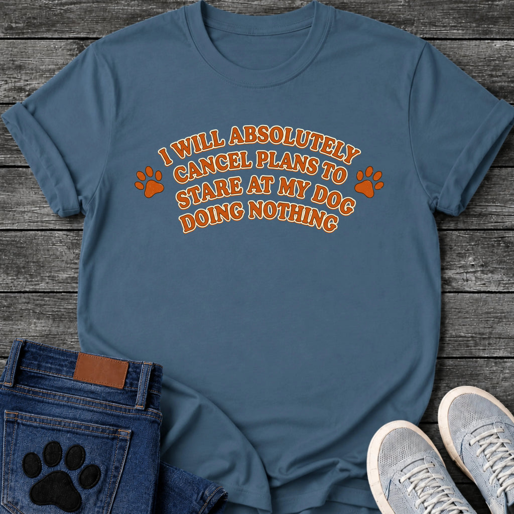 Retro arched graphic tee design in orange and cream reading "I Will Absolutely Cancel Plans to Stare at My Dog Doing Nothing," with a paw print on each side.