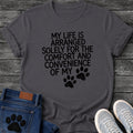 Distressed bold graphic tee design reading "My Life Is Arranged Solely for the Comfort and Convenience of My," with two textured paw prints standing in for the word dog.