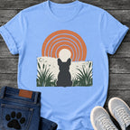 French Bulldog t-shirt with Frenchie silhouette seen from behind sitting in dark green botanical cattails and grass, cream circle moon rising behind the head, bold concentric terracotta arch above, distressed torn edge ground texture, no text boho art graphic
