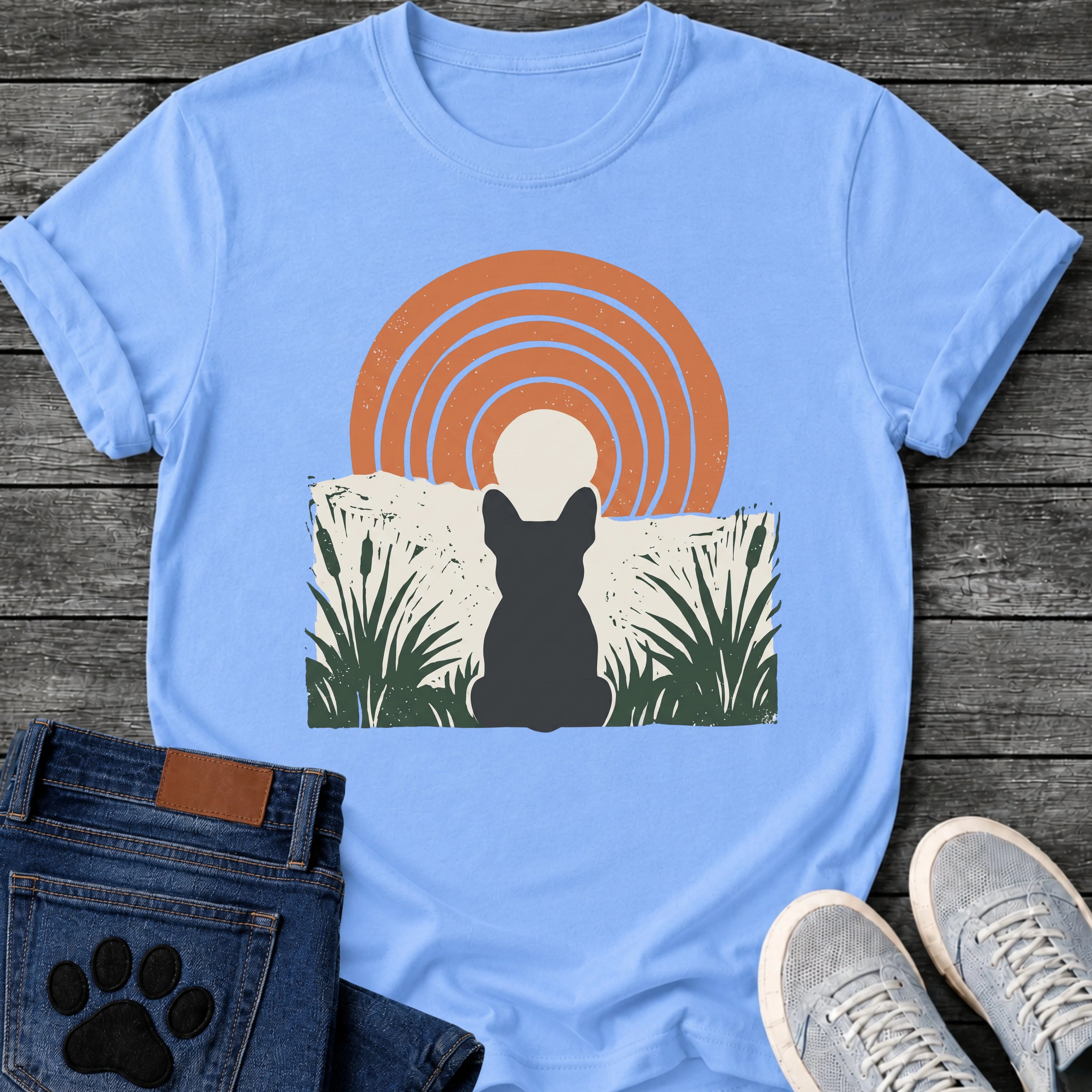French Bulldog t-shirt with Frenchie silhouette seen from behind sitting in dark green botanical cattails and grass, cream circle moon rising behind the head, bold concentric terracotta arch above, distressed torn edge ground texture, no text boho art graphic
