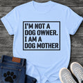 Bold stencil style graphic tee design with "I'm Not a Dog Owner, I Am a Dog Mother" text in a boxed frame.