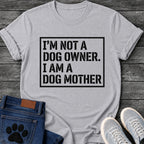 Bold stencil style graphic tee design with "I'm Not a Dog Owner, I Am a Dog Mother" text in a boxed frame.