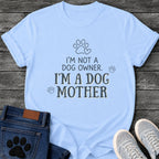 Charcoal graphic tee design with hand lettered "I'm Not a Dog Owner, I'm a Dog Mother" text, paw print and heart illustrations
