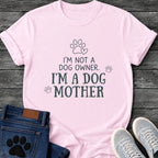 Charcoal graphic tee design with hand lettered "I'm Not a Dog Owner, I'm a Dog Mother" text, paw print and heart illustrations